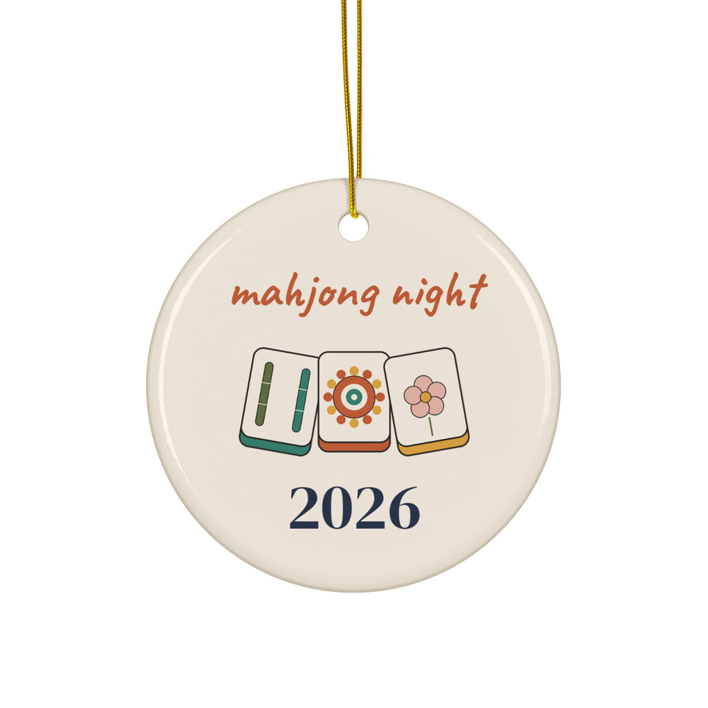 Mahjong Night 2026 round ceramic Christmas ornament with three illustrated mahjong tiles and a gold ribbon, front