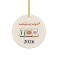Mahjong Night 2026 round ceramic Christmas ornament with three illustrated mahjong tiles and a gold ribbon, front