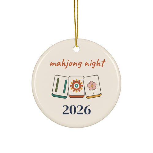 Mahjong Night 2026 round ceramic Christmas ornament with three illustrated mahjong tiles and a gold ribbon, front