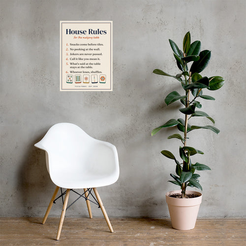 Mahjong House Rules poster, 18x24, hanging on a grey wall above a white chair and a potted plant